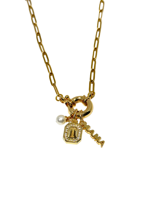 Gold necklace with charms on a white background